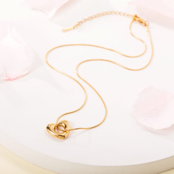 Light luxury stainless steel 18k gold plated color preserving snake bone chain simple waterproof hollow heart titanium steel necklace - Image 2